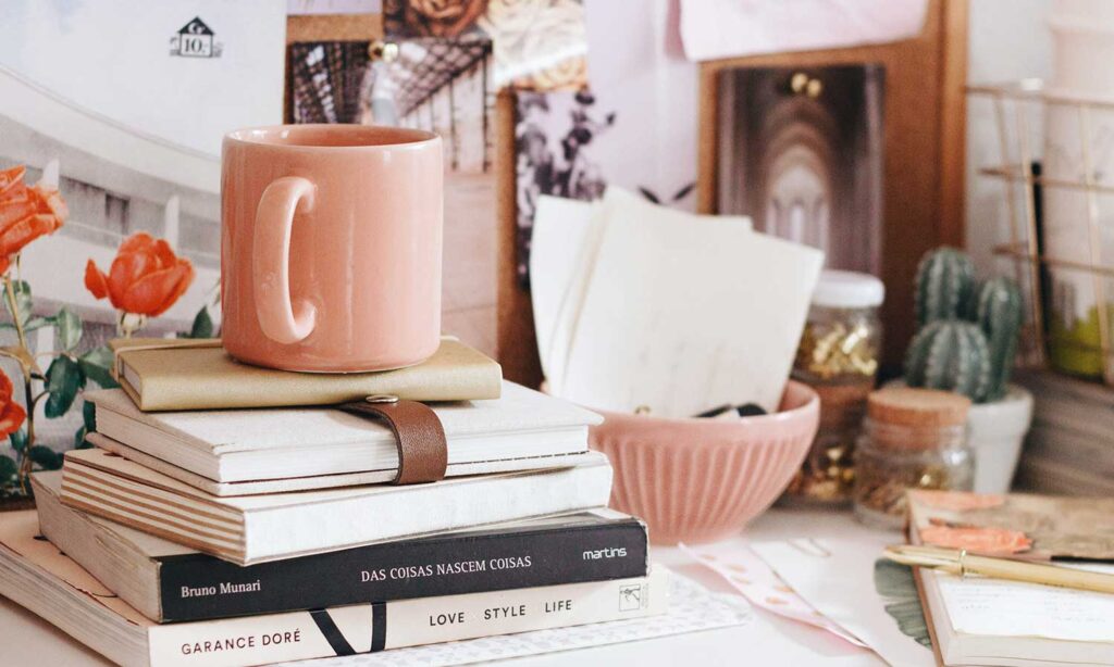 feminine office with books and coffee